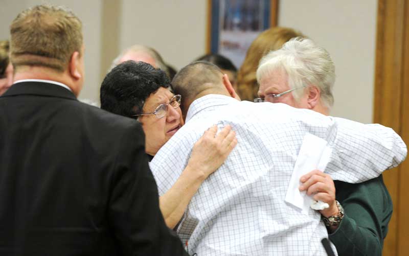 Tapp, his mother, Vera, and Carol Dodge embrace at the end of Wednesday’s hearing (Taylor Carpenter, Pool Photo)