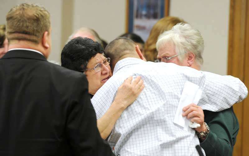 Tapp, his mother, Vera, and Carol Dodge embrace at the end of Wednesday’s hearing (Taylor Carpenter, Pool Photo)