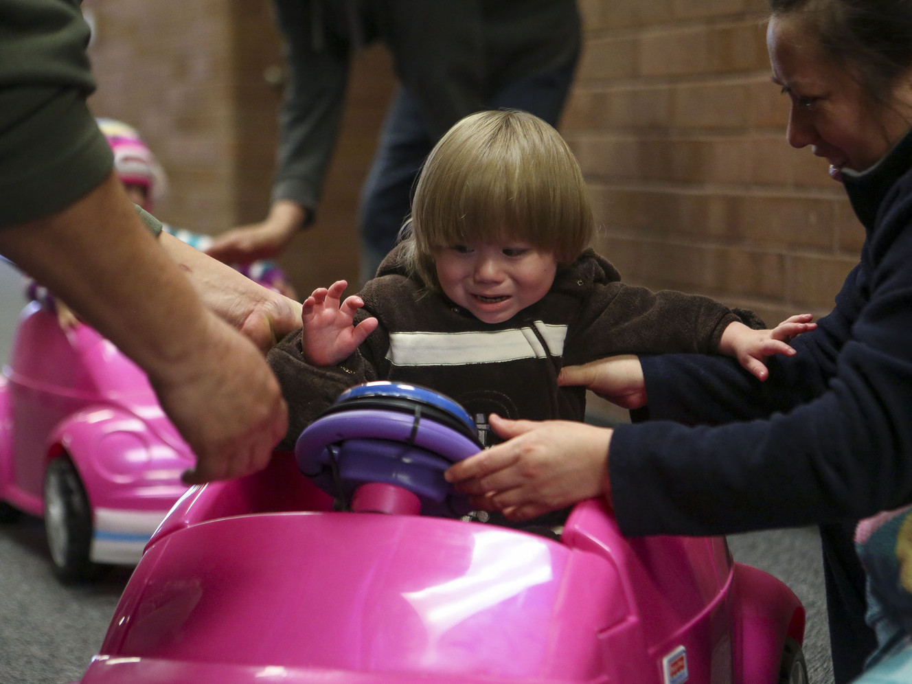 Toddlers get up and go in their own set of wheels