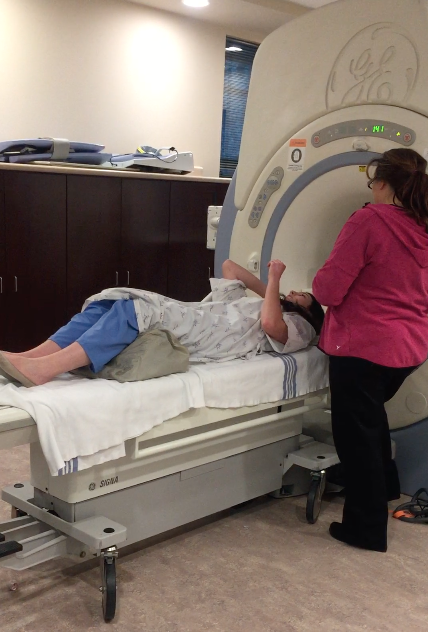 Receiving an MRI scan.