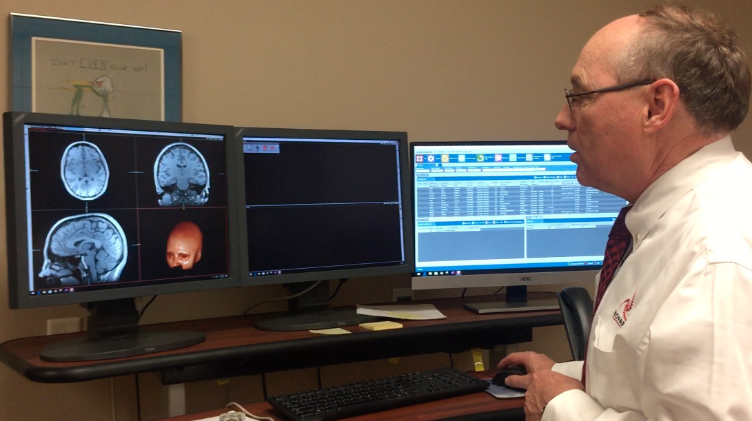 Dr. Gibby looks at my MRI scans.