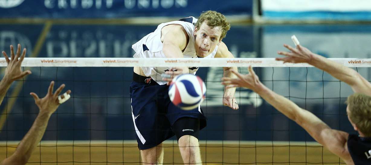 BYU's Jake Langlois hammers a spike into at the Long Beach State defense as they play volleyball in Provo, BYU won 3 sets to 2 on Friday, March 24, 2017. (Photo: Scott G Winterton, Deseret News)