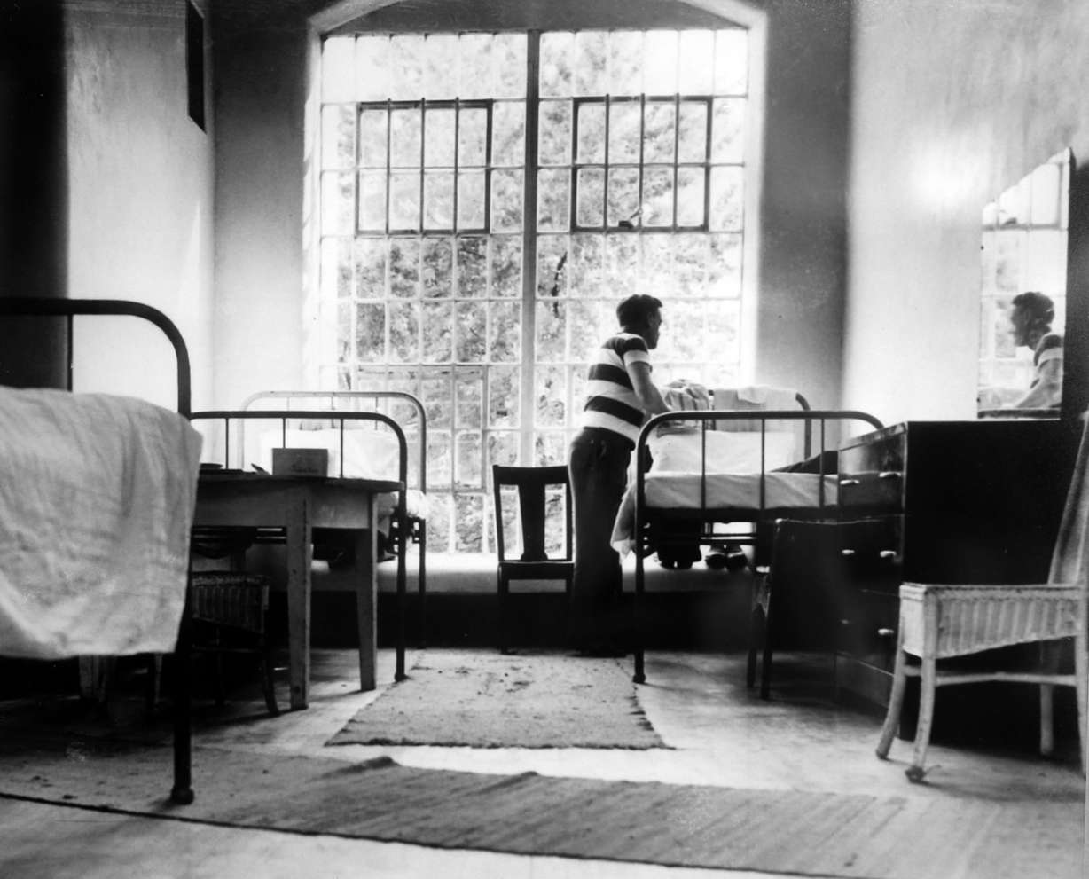 A photograph of patients who resided in the Utah Territorial Insane Asylum — now the Utah State Hospital — during the 1900s hangs on the wall of the hospital's museum in Provo on Wednesday, March 22, 2017. The Forgotten Patient’s Cemetery Project is planning to erect memorials and plaques to honor the patients who are buried in unmarked graves at the Provo City Cemetery. (Photo: Utah State Hospital Museum)