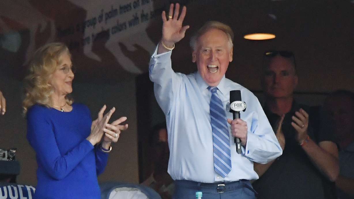 Hall of Fame broadcaster Vin Scully, seen here on Oct. 20, 2016, whose dulcet tones provided the soundtrack of summer while entertaining and informing Dodgers fans in Brooklyn and Los Angeles for 67 years, died Tuesday night, the team said. He was 94.