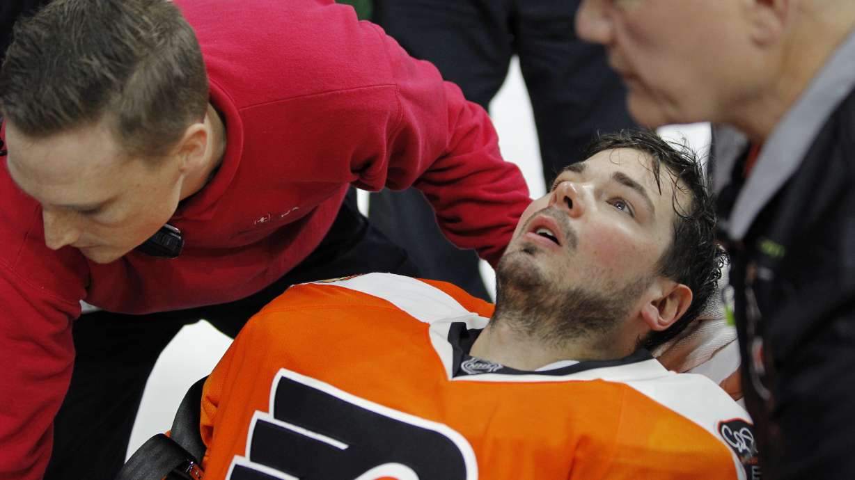 Flyers' Neuvirth carted off ice after collapsing in crease
