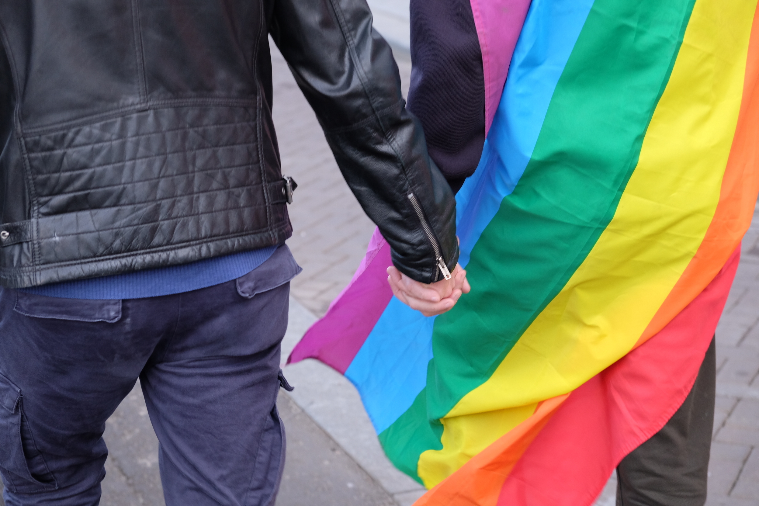 Dutch men hold hands in solidarity with beaten gay couple