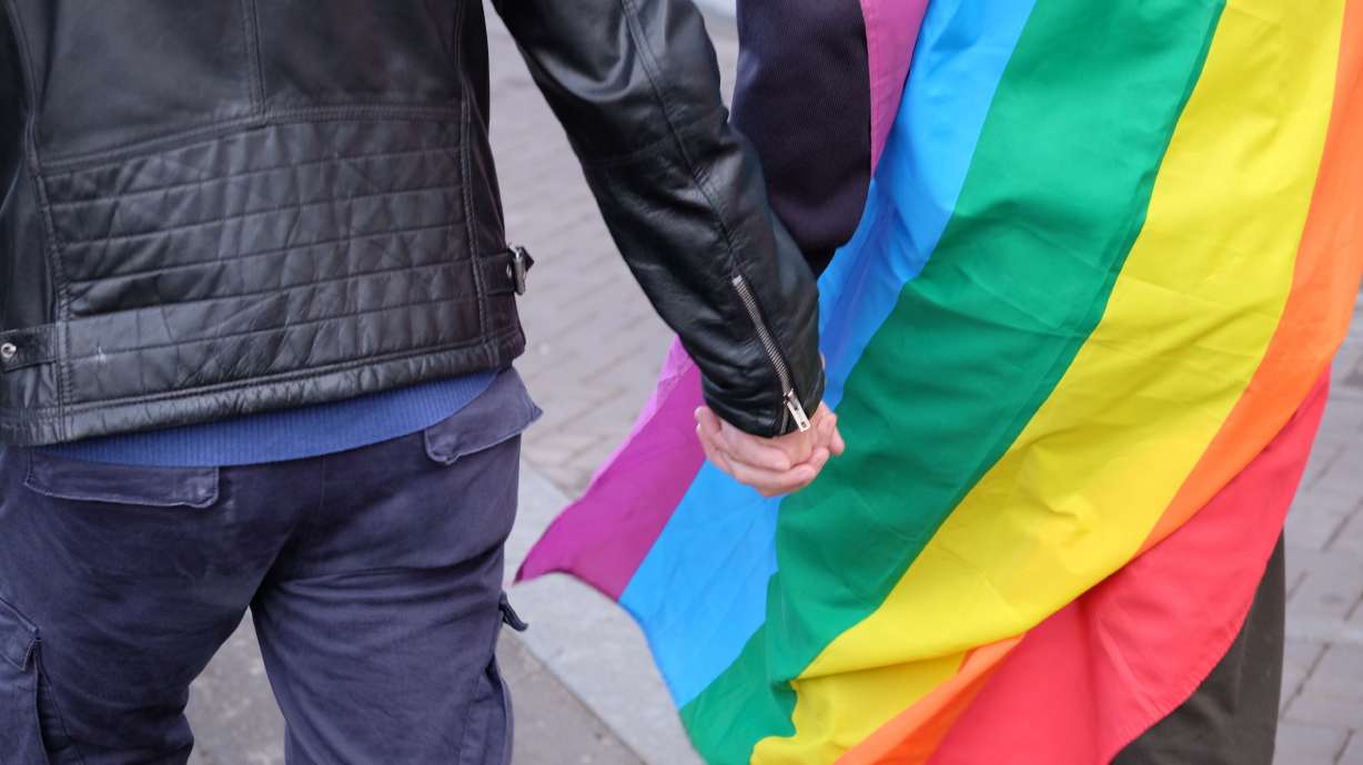 Dutch men hold hands in solidarity with beaten gay couple