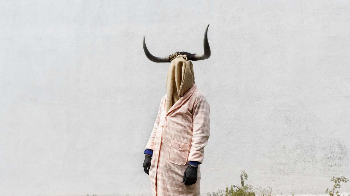 AP PHOTOS: Spanish parades feature bizarre costumes, masks