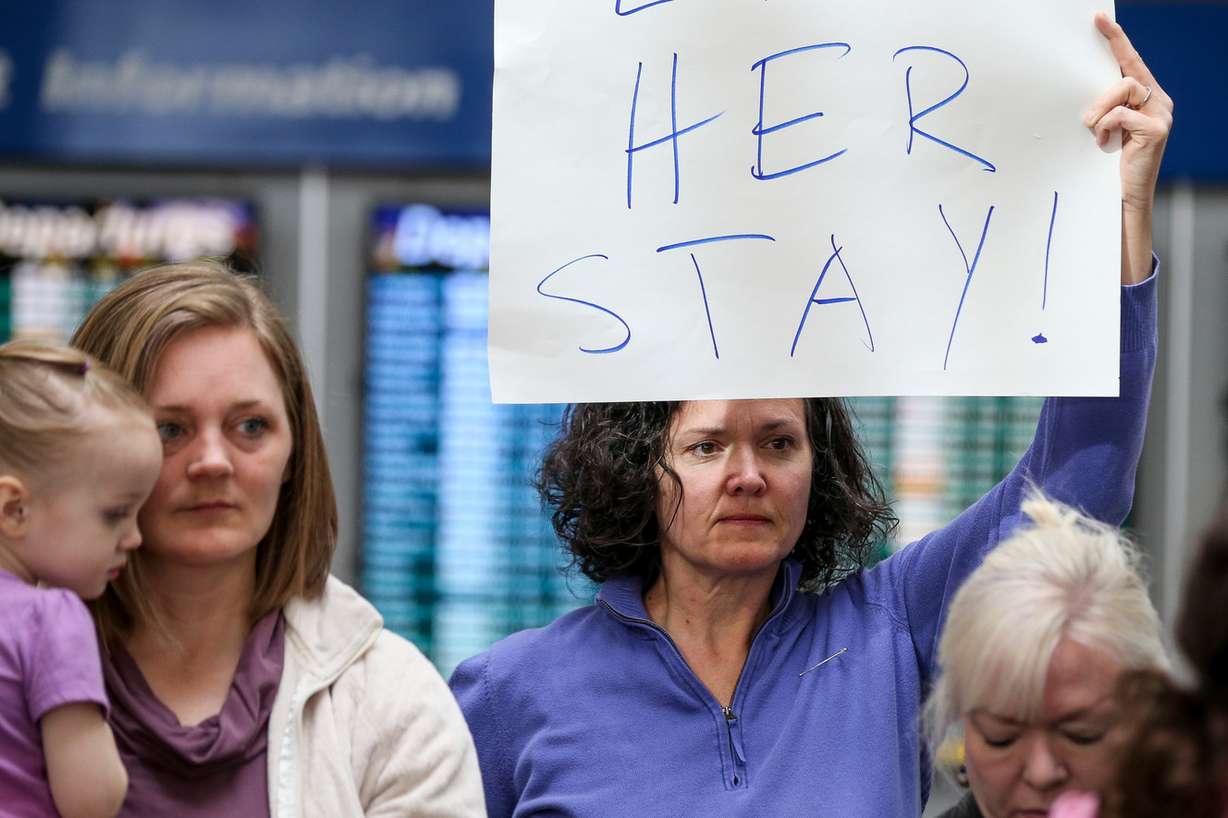 Tiffany Smith, of Millcreek, joins others at a press conference at the Salt Lake City International Airport on Thursday, April 6, 2017. The group Mormon Women for Ethical Government and others gathered to protest the deportation of Utah resident Isabel, a pseudonym, and the federal government's "changed priorities" for deportation. (Photo: Spenser Heaps, Deseret News)