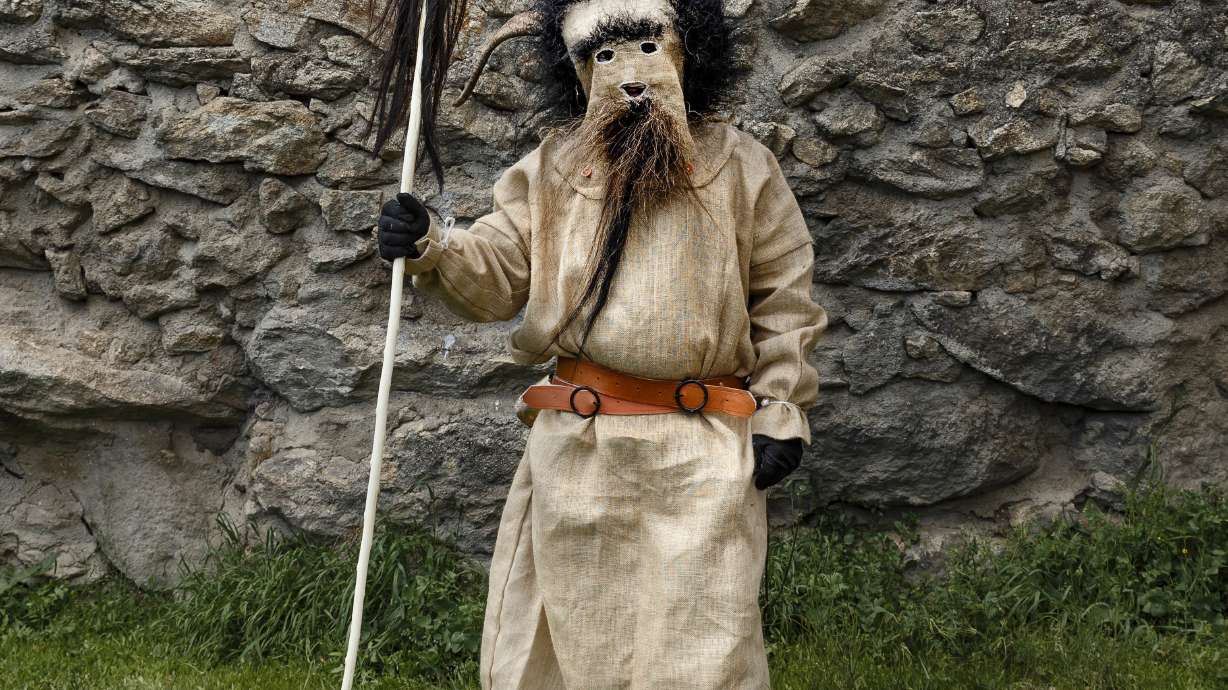 AP PHOTOS: Costumed characters converge on Spanish town