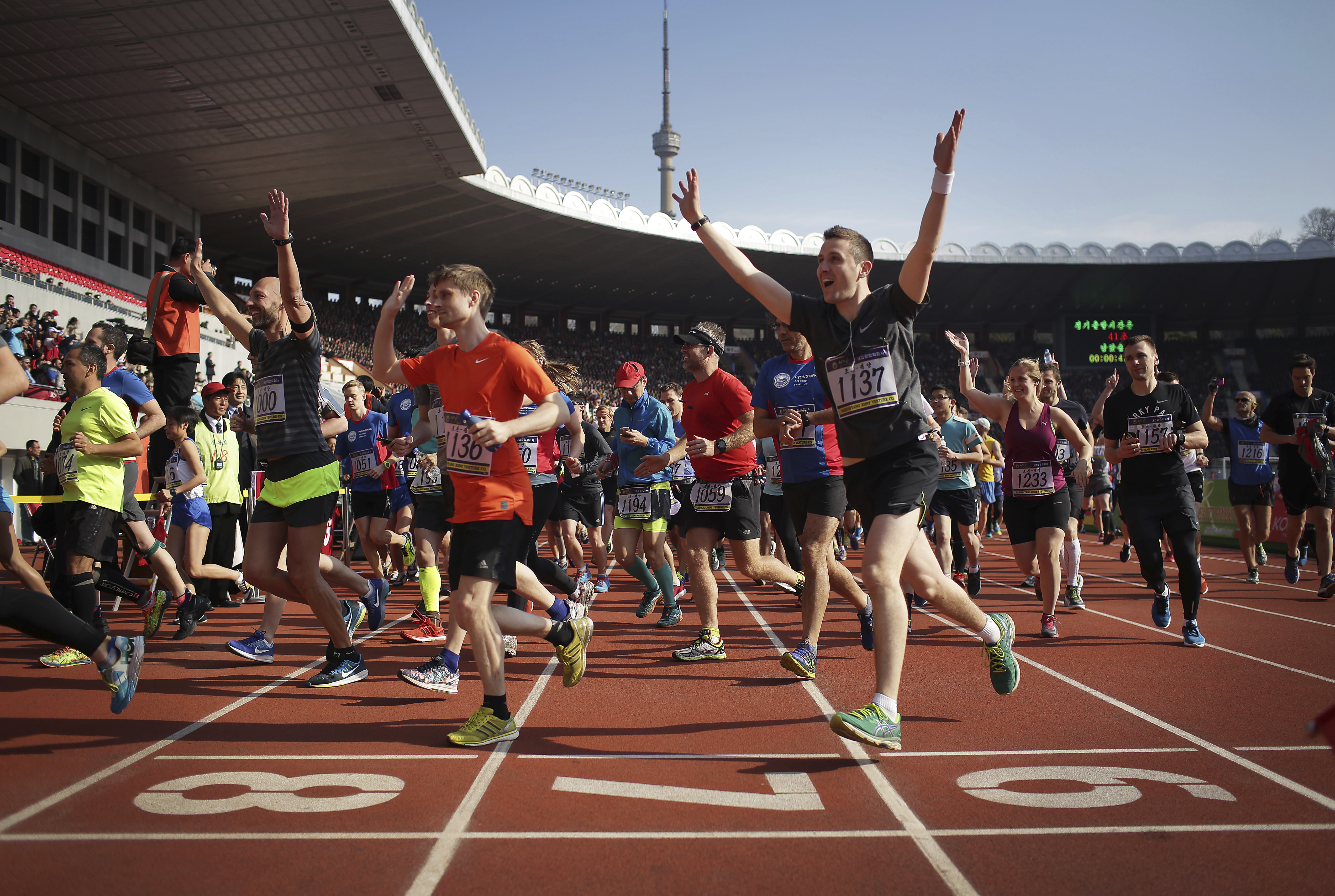 AP PHOTOS: Foreigners crowd Pyongyang streets for marathon