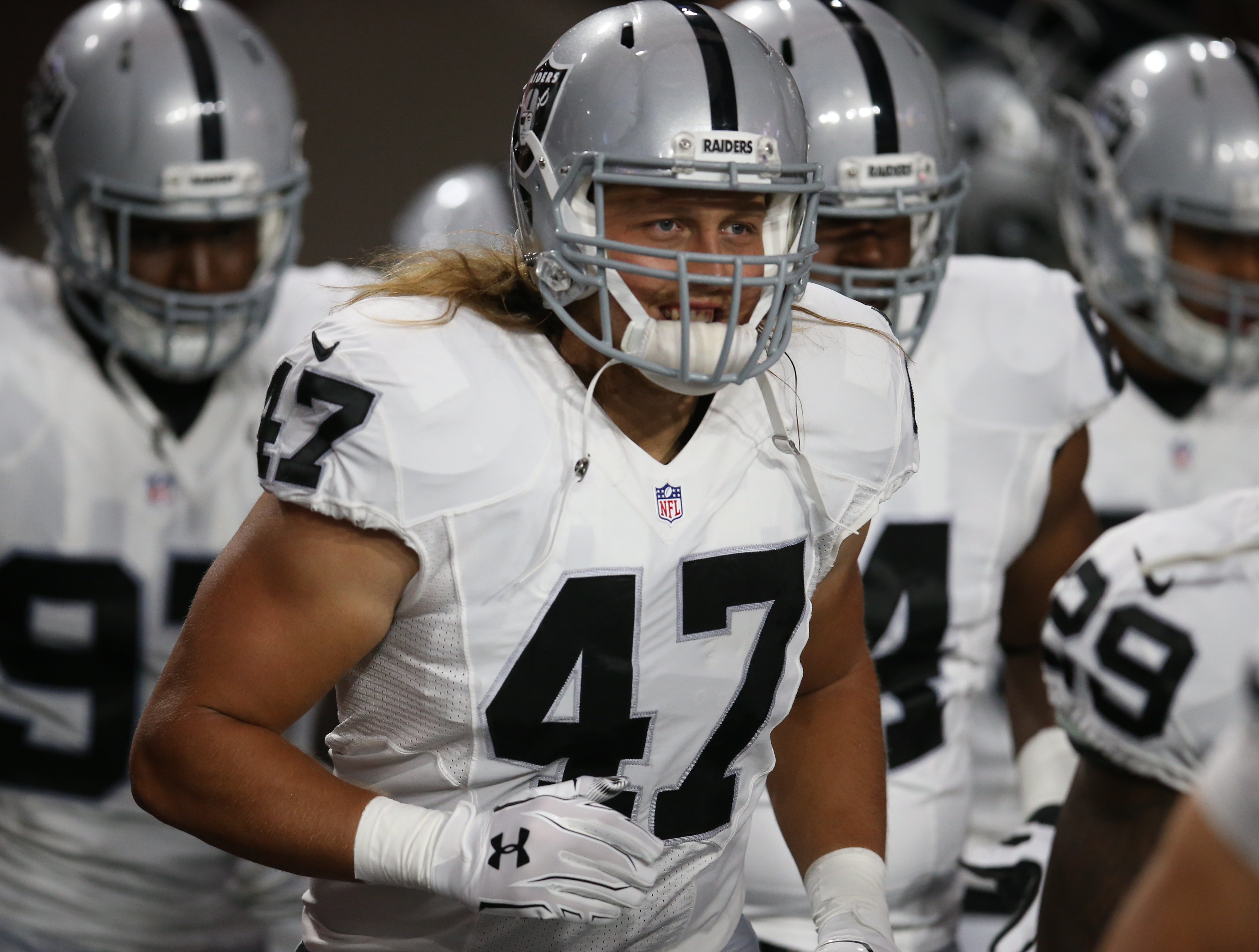 Oakland Raiders defensive end James Cowser (47), shown during an NFL preseason football game against the Arizona Cardinals, Friday, Aug. 12, 2016, is excited for his franchise's move to Las Vegas — just two hours away from his college home at Southern Utah. (AP Photo/Rick Scuteri)