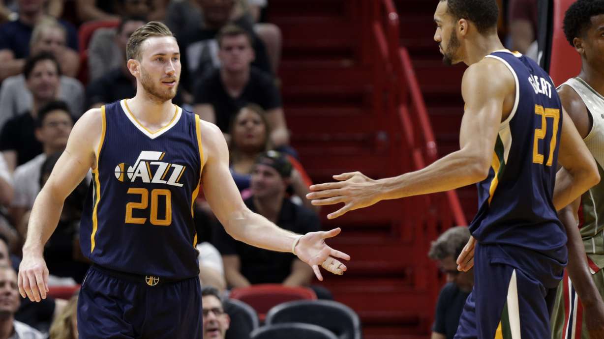 Gobert Hayward high fives teammate Rudy Gobert.