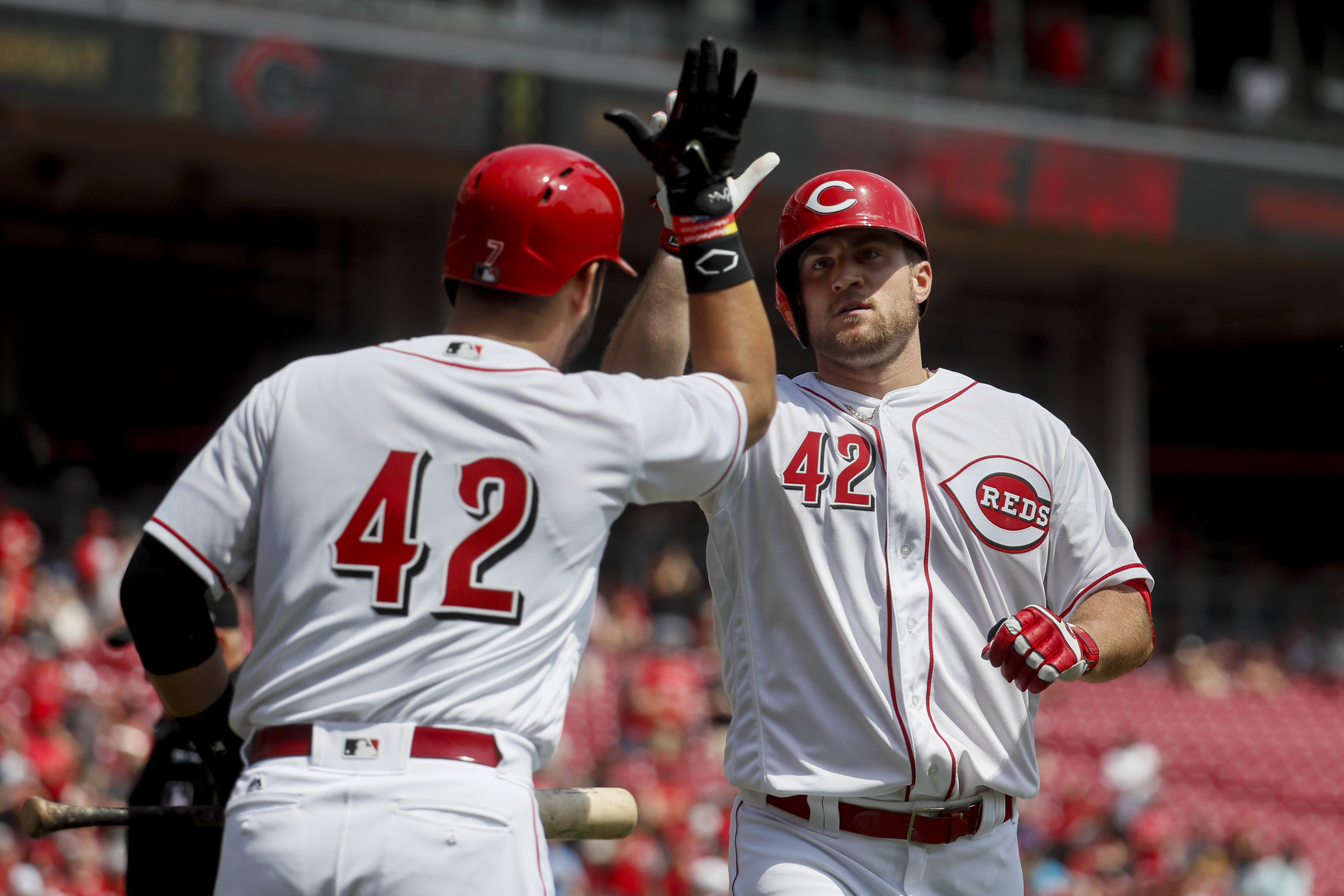 Reds lose a starter, but Winker's double beats Brewers 7-5
