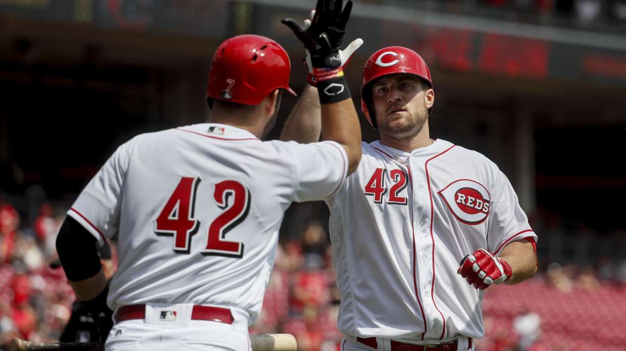 Reds lose a starter, but Winker's double beats Brewers 7-5