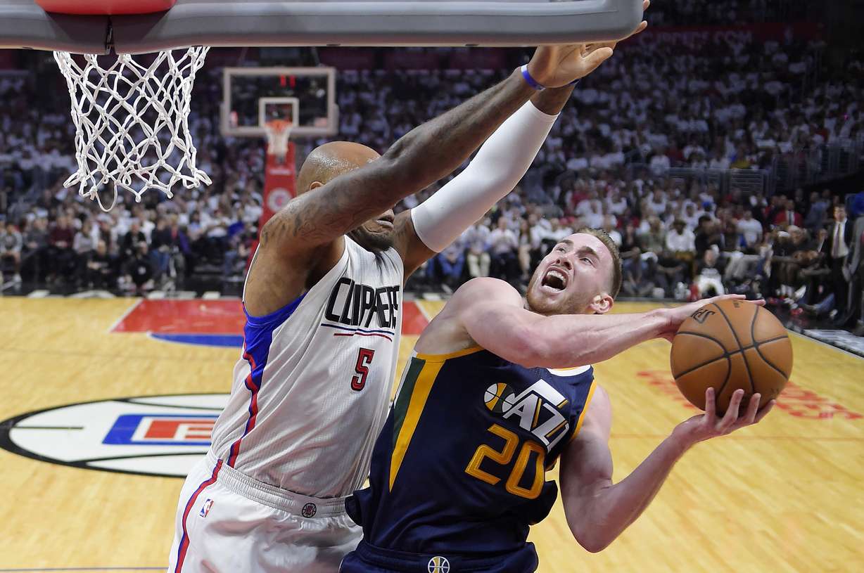 Utah Jazz forward Gordon Hayward, right, is fouled while shooting by Los Angeles Clippers center Marreese Speights during the second half in Game 1 of an NBA basketball first-round playoff series, Saturday, April 15, 2017, in Los Angeles. The Jazz won 97-95. (Mark J. Terrill, AP Photo)
