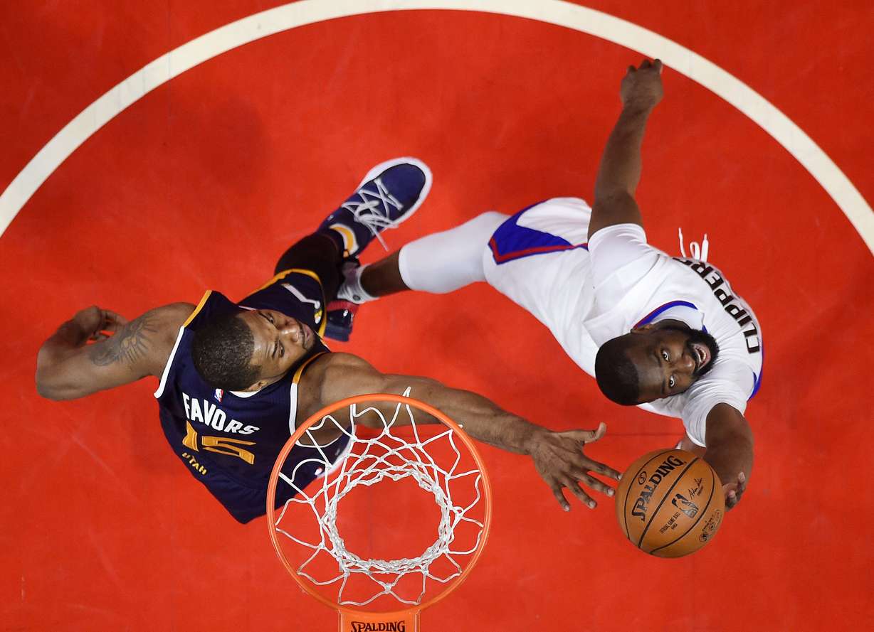 Los Angeles Clippers guard Raymond Felton, right, shoots as Utah Jazz forward Derrick Favors defends during the second half in Game 1 of an NBA basketball first-round playoff series, Saturday, April 15, 2017, in Los Angeles. The Jazz won 97-95. (Mark J. Terrill, AP Photo)