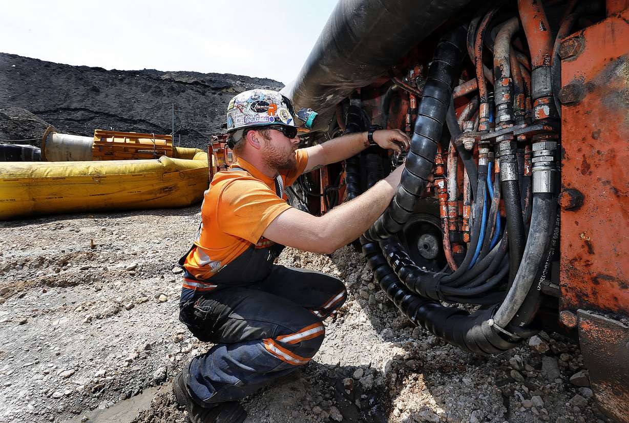 Josh Spigarelli works on machinery at the Burton No. 1 mine in Alton on Thursday, Aug. 20, 2015. Photo: Ravell Call, Deseret News