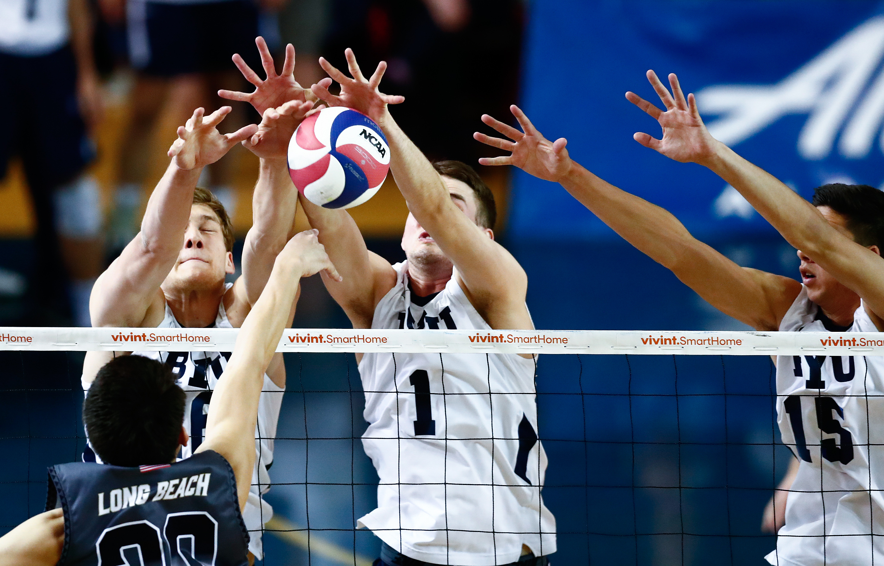 BYU's Tim Dobbert (16) and Price Jarman (1) block an attack in the first set against No. 1 Long Beach State at the Smith Fieldhouse in Provo, Utah. March 25, 2017. (Photo: Jaren Wilkey, BYU Photo)