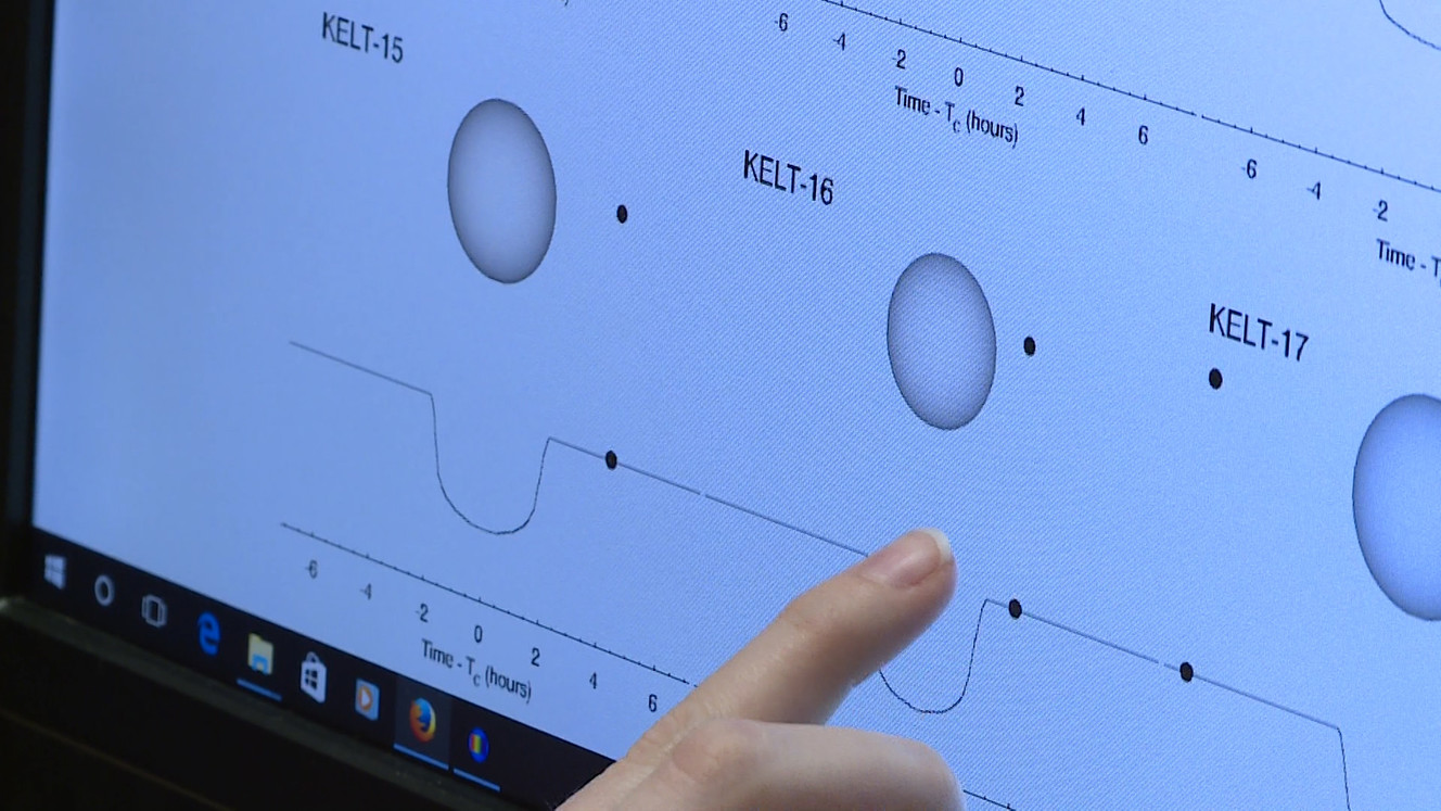 BYU student Leann Farnbach points to an animation of KELT-16b. (Photo: Ray Boone)