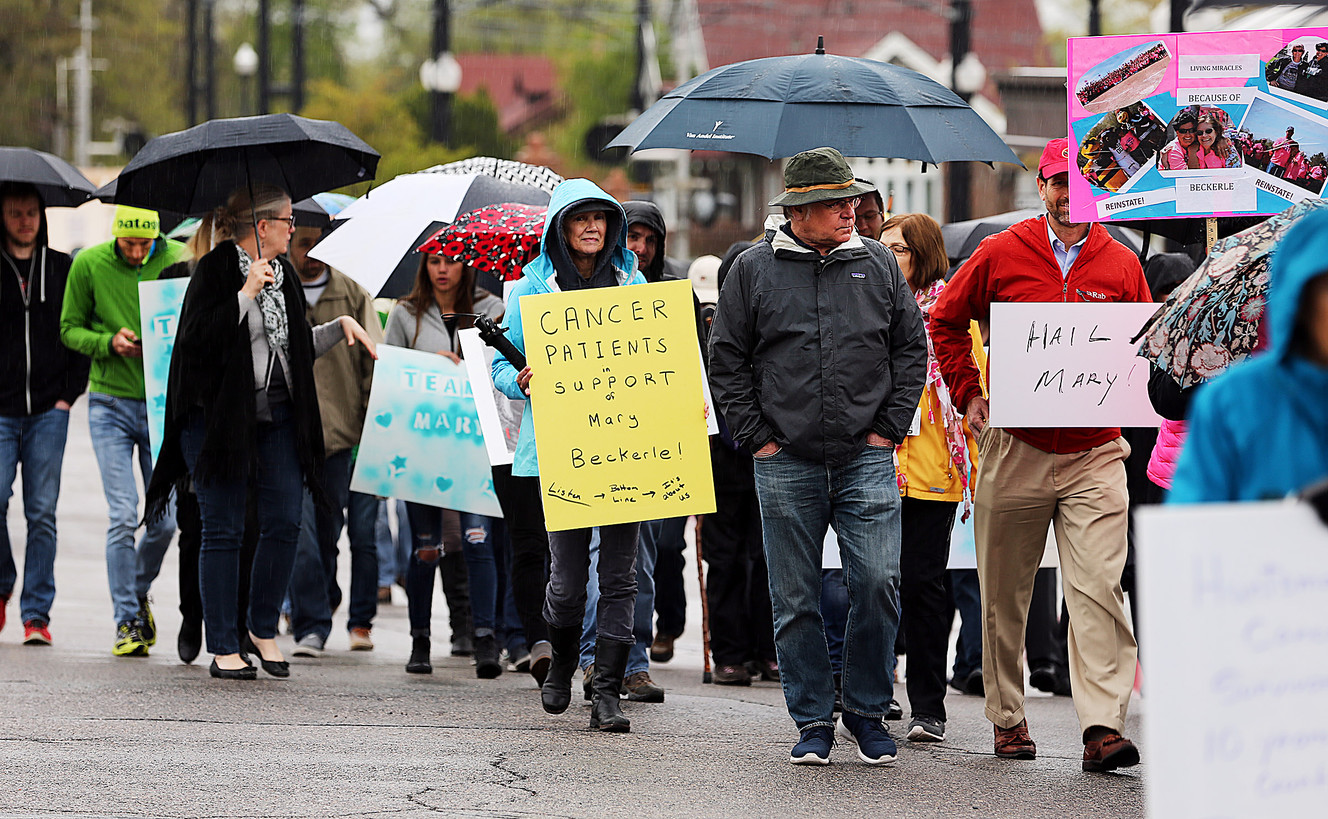 Dozens of cancer patients and others march to University of Utah President David W. Pershing's office on Monday, April 24, 2017, calling for the reinstatement of Dr. Mary Beckerle as director and CEO of the Huntsman Cancer Institute. (Photo: Scott G Winterton, Deseret News)