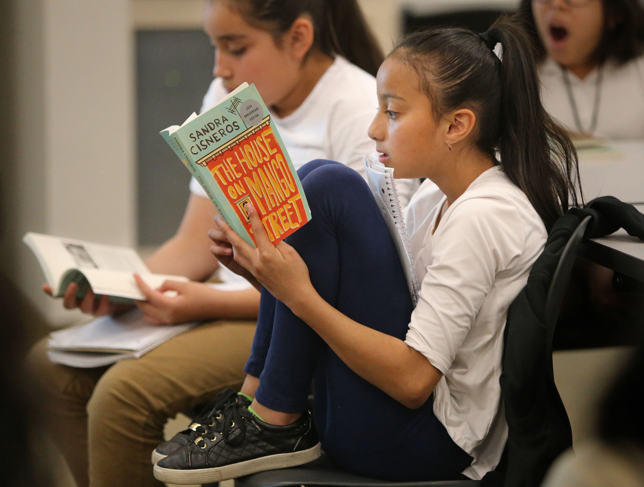 Valeria Avila reads through "The House on Mango Street" as the author, Sandra Cisneros, talks to Mountain View Elementary fifth-graders at the Glendale Mountain View Community Learning Center in Salt Lake City on Wednesday, April 26, 2017. (Photo: Kristin Murphy, Deseret News)
