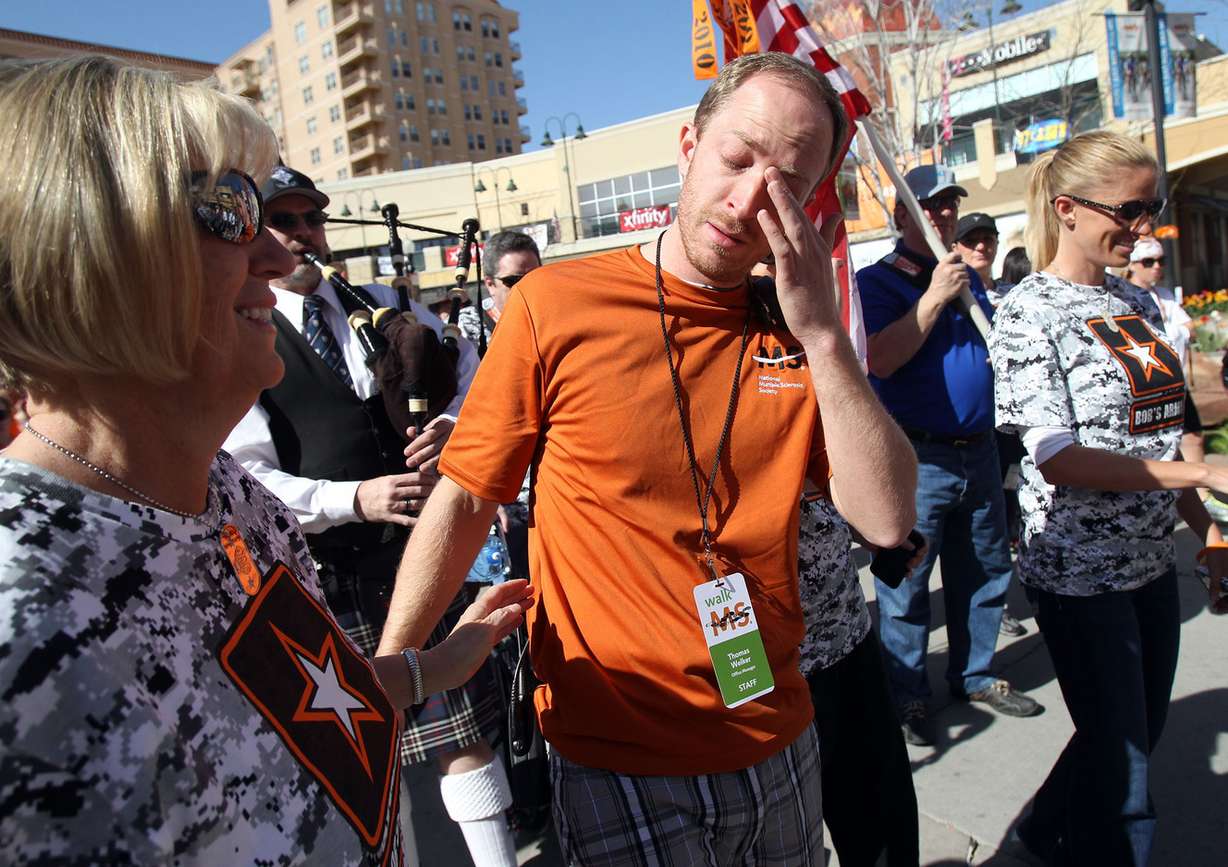 Sharon Welker comforts her son Thomas Welker as he is brought to tears at the MS Walk in Salt Lake City in 2013. (Photo: Kristin Murphy, Deseret News)