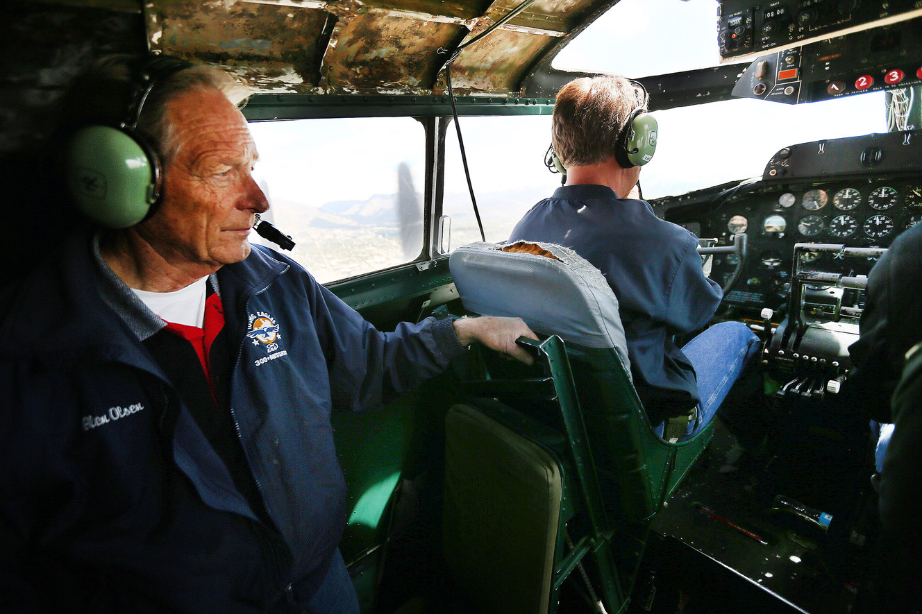 Glen Olsen watches from behind as pilot David Lyon flies the "Madras Maiden," a restored World War II B-17 "flying fortress" bomber, over Salt Lake City on Monday, May 1, 2017. (Photo: Scott G Winterton, Deseret News)