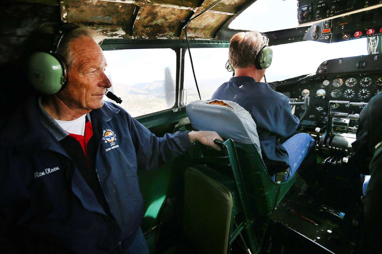 Glen Olsen watches from behind as pilot David Lyon flies the "Madras Maiden," a restored World War II B-17 "flying fortress" bomber, over Salt Lake City on Monday, May 1, 2017. (Photo: Scott G Winterton, Deseret News)