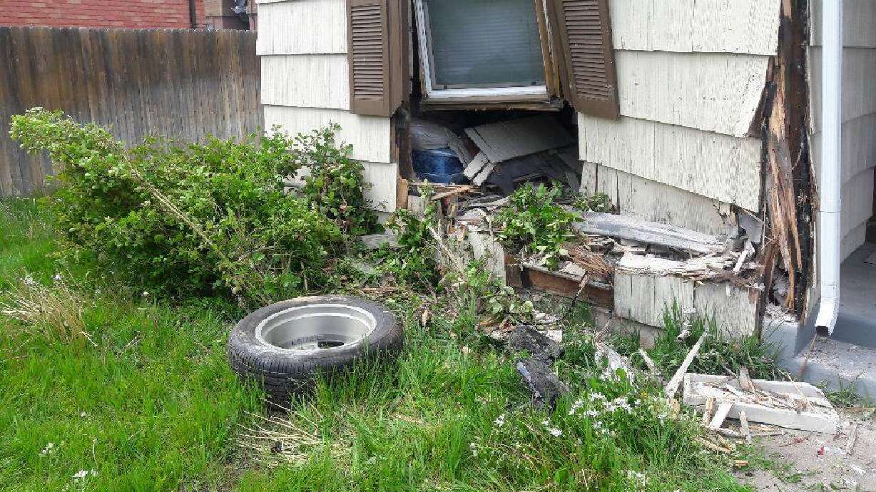 SUV crashes into Provo house during police chase