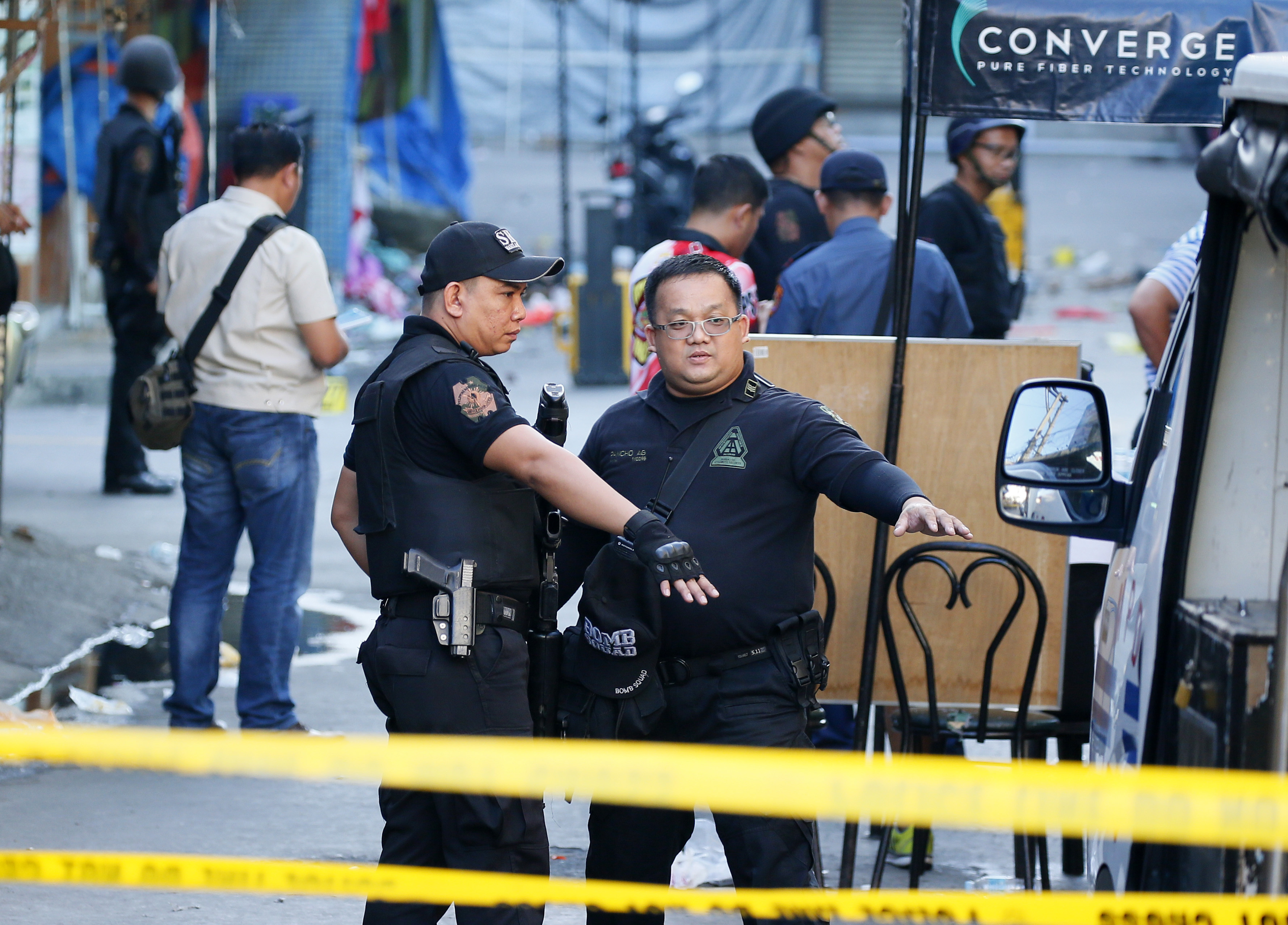 Philippines says bomb sparked by feud but IS claims attack