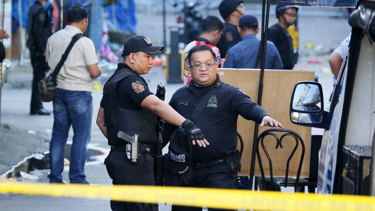 Philippines says bomb sparked by feud but IS claims attack