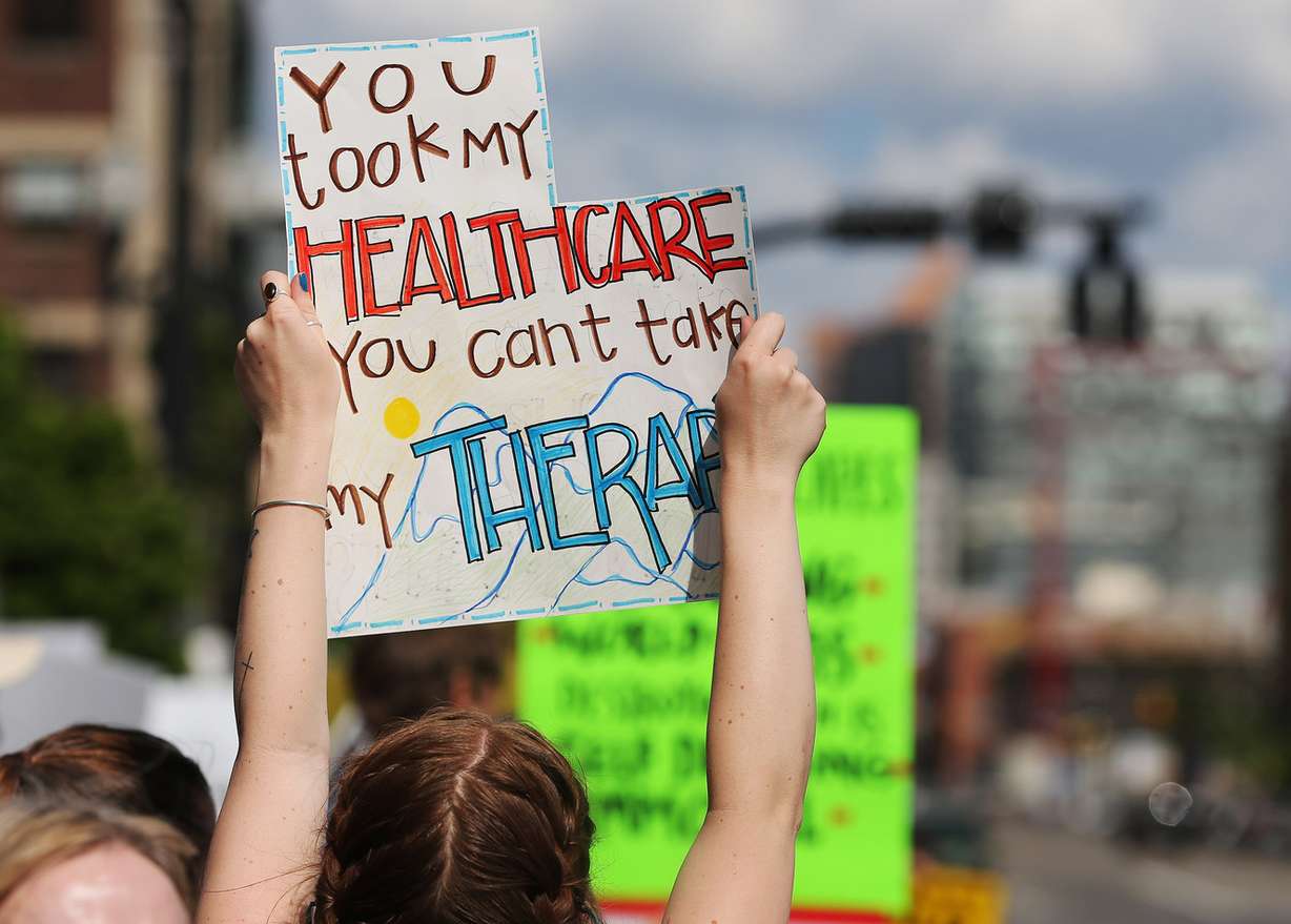 Demonstrators rally outside the BLM offices as Sen. Orrin Hatch, R-Utah, meets with Secretary of the Interior Ryan Zinke during a listening tour of Utah monuments in Salt Lake City on Sunday, May 7, 2017. (Photo: Jeffrey D. Allred, Deseret News)