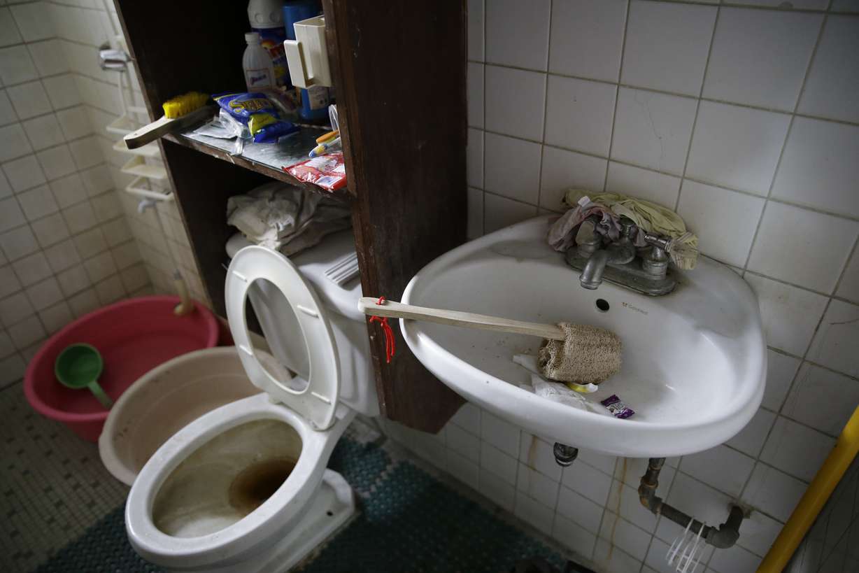 Underwear is wedged behind the faucet of the bathroom sink inside the home of suspected child webcam cybersex operator, David Timothy Deakin, from Peoria, Ill., during a raid in Mabalacat, Philippines. Photo: AP Photo