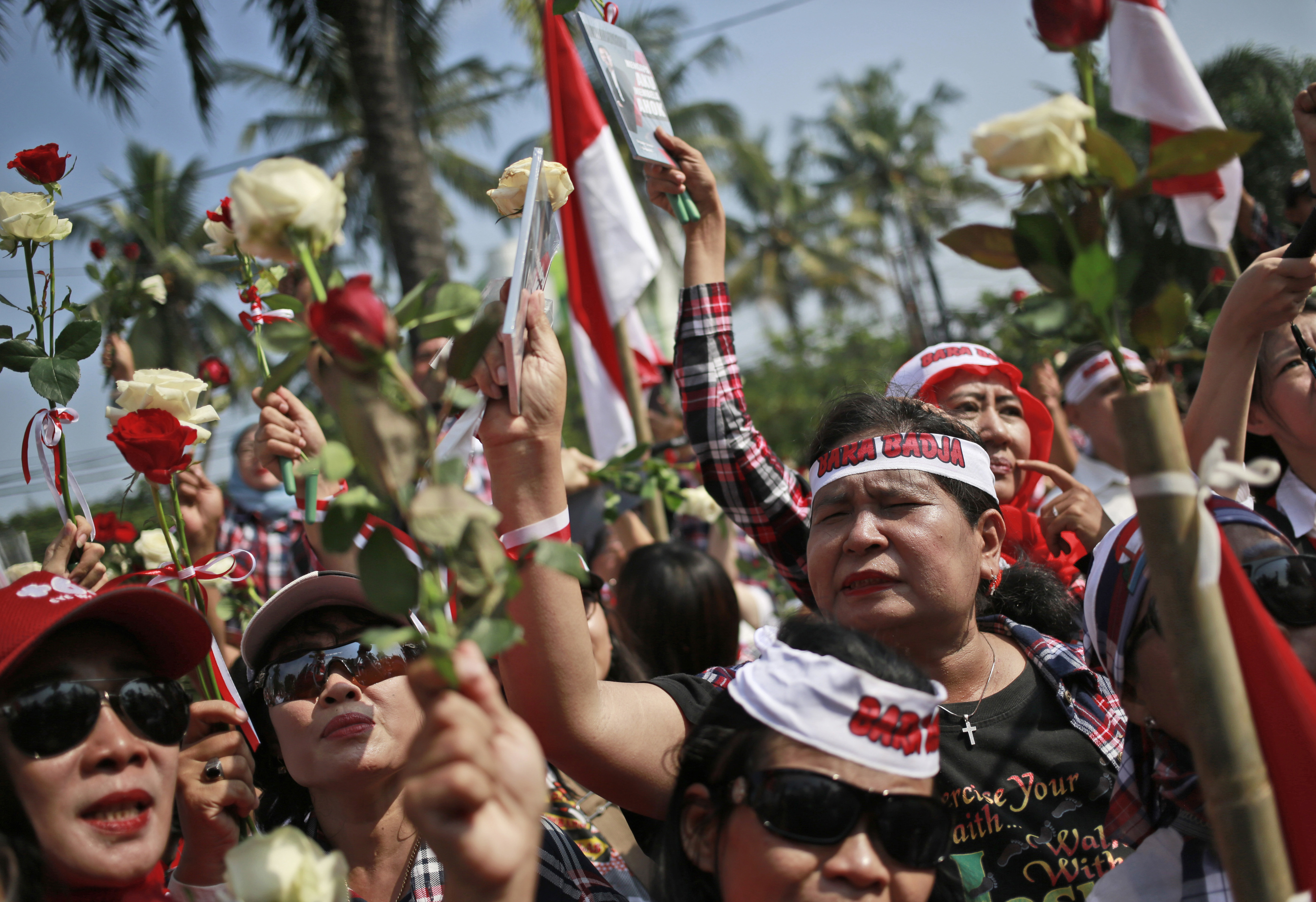 The Latest: Crowds mass at jail where Jakarta governor held