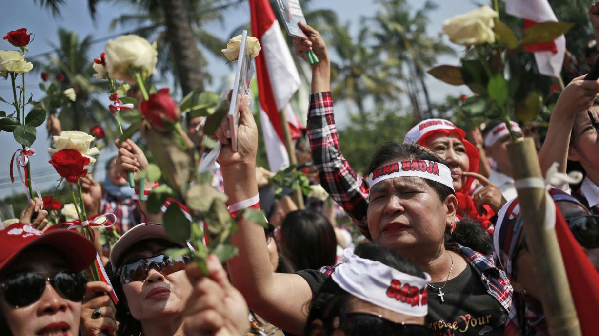 The Latest: Crowds mass at jail where Jakarta governor held