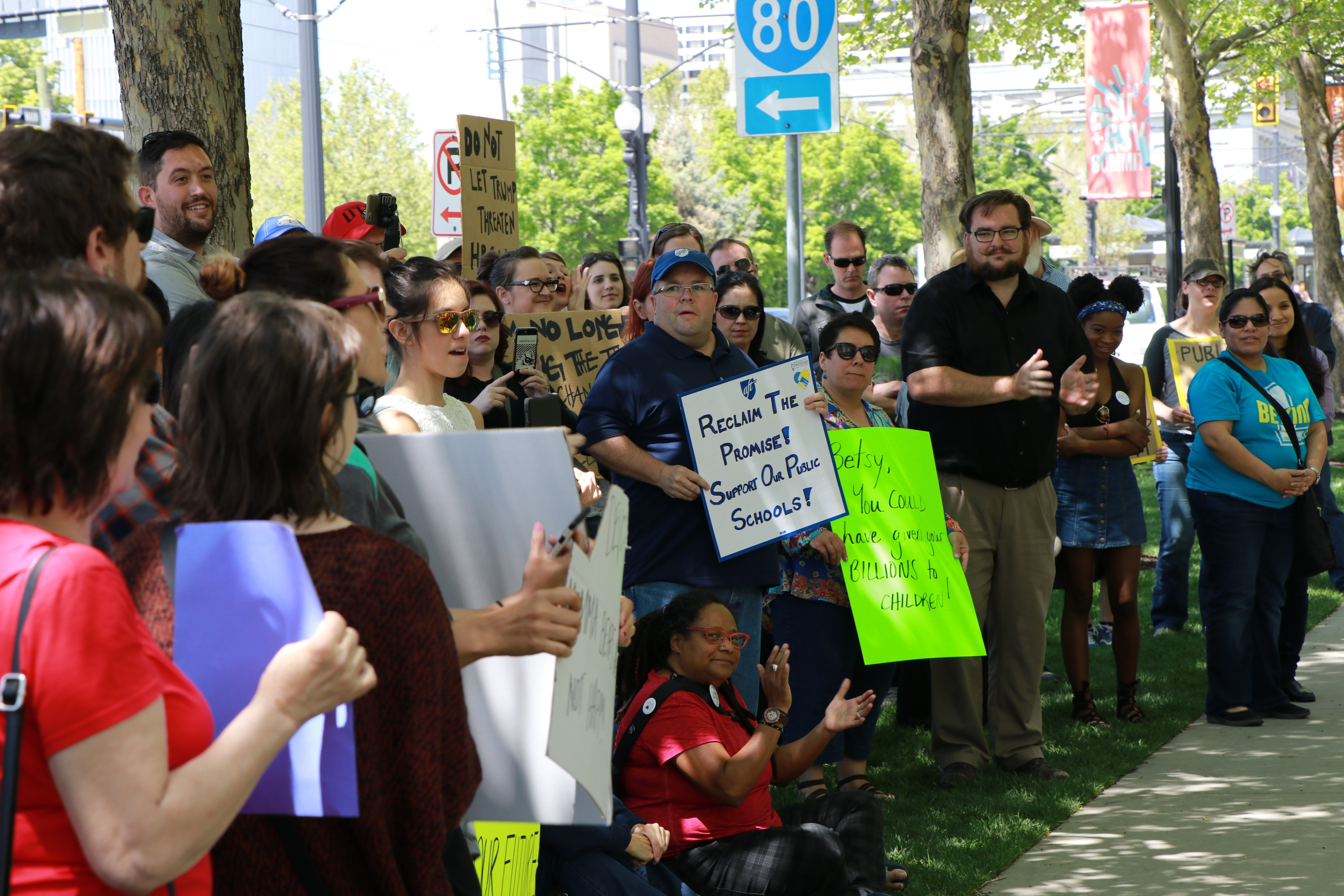 Protestors gather in front of the Grand America Hotel.  Photo: Liesl Nielsen