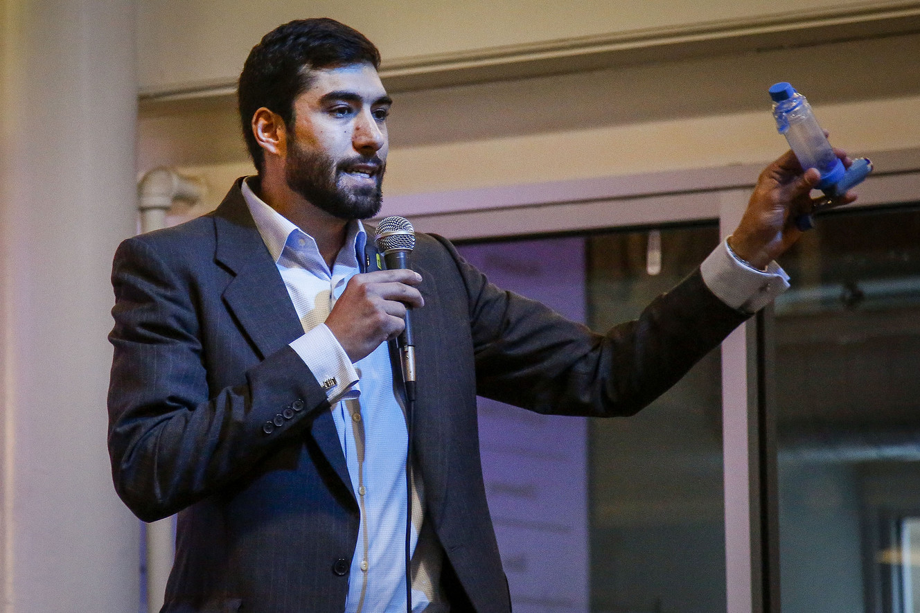 Chris Ciancone, CEO/Founder of Waterbear Life Devices (LIYEN), shows off an old inhaler and spacer system during the Technology Commercialization and Innovation Demo Day event. Photo: Nicole Boliaux, Deseret News