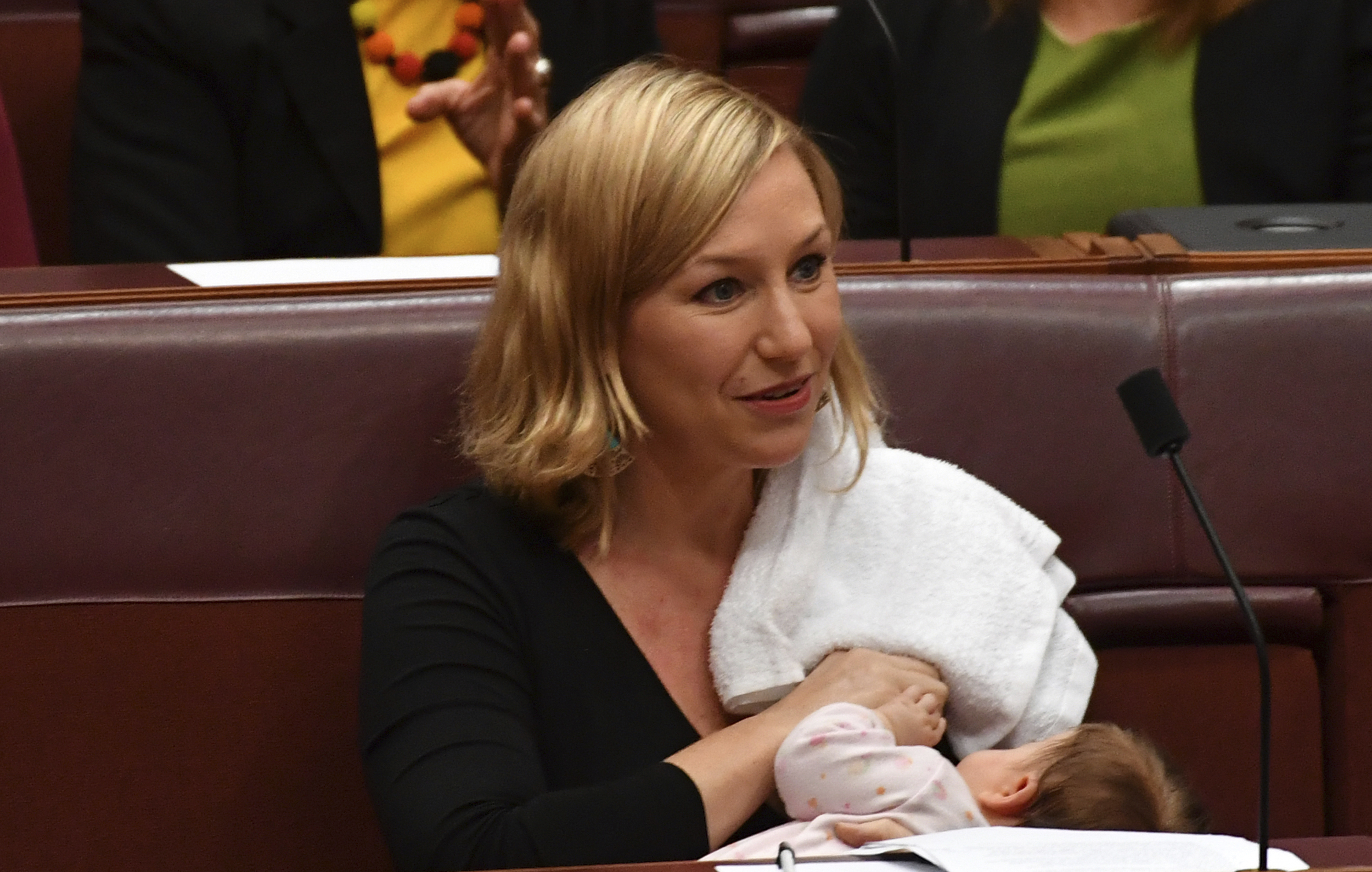Australian senator breastfeeds baby on floor of Parliament