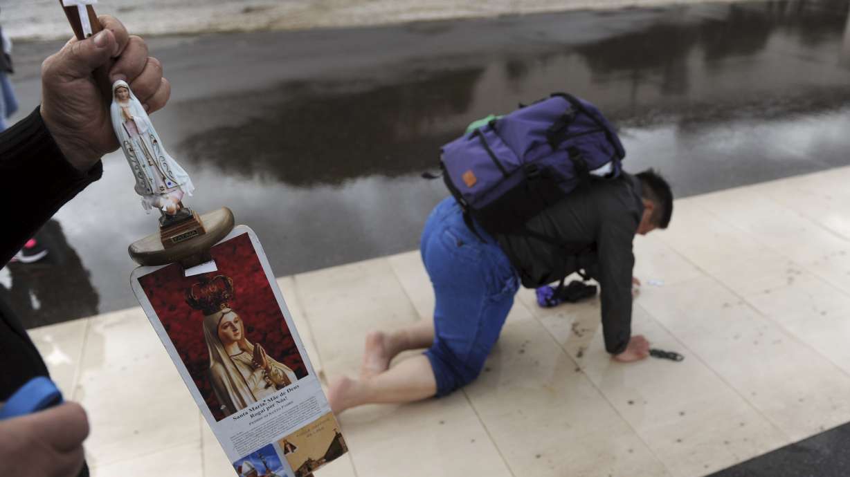 Pope cheered in Fatima to honor children who urged peace