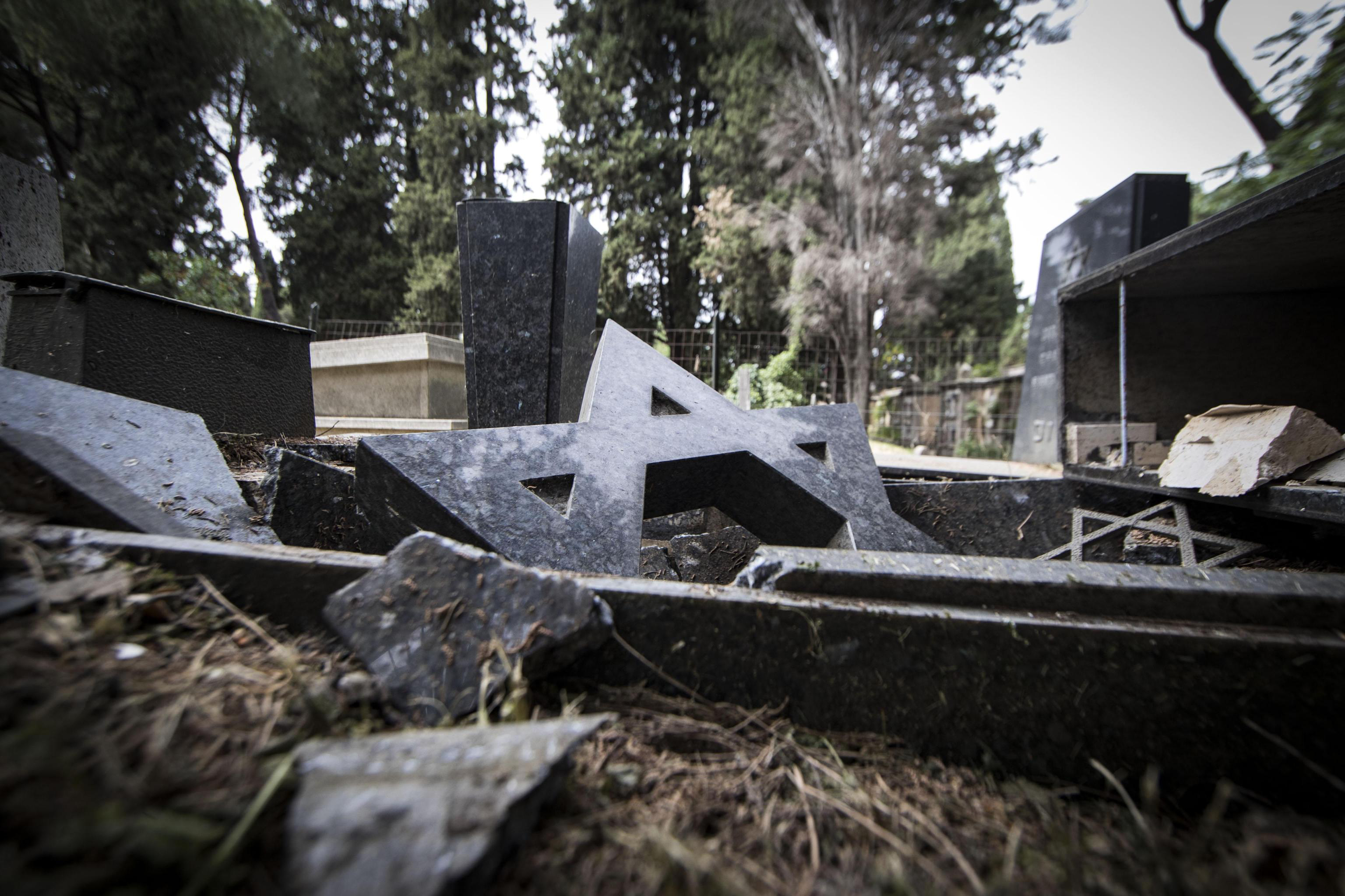 Nighttime vandals smash some 70 headstones at Rome cemetery
