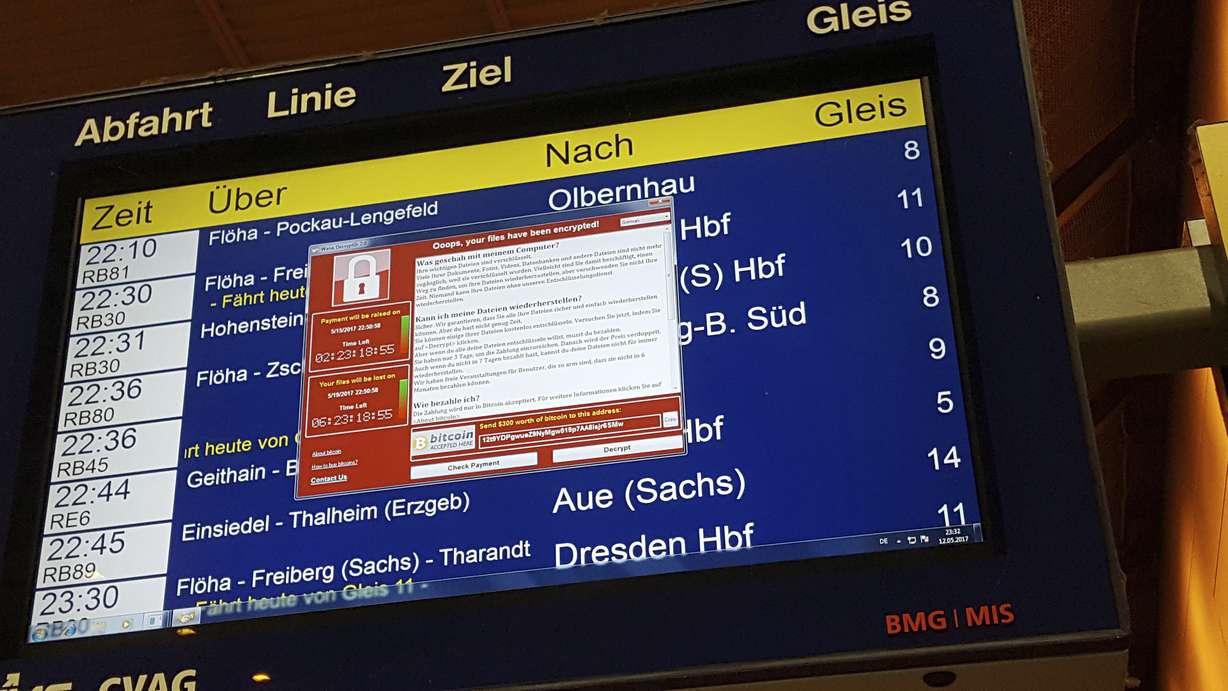 In this May 12, 2017 photo, a display panel with an error can be seen at the main railway station in Chemnitz, Germany. Germany’s national railway says that it was among the organizations affected by the global cyberattack but there was no impact on train services. Deutsche Bahn said early Saturday that departure and arrival display screens at its stations were hit Friday night by the attack. (Photo: P. Goezelt/dpa via Associated Press)