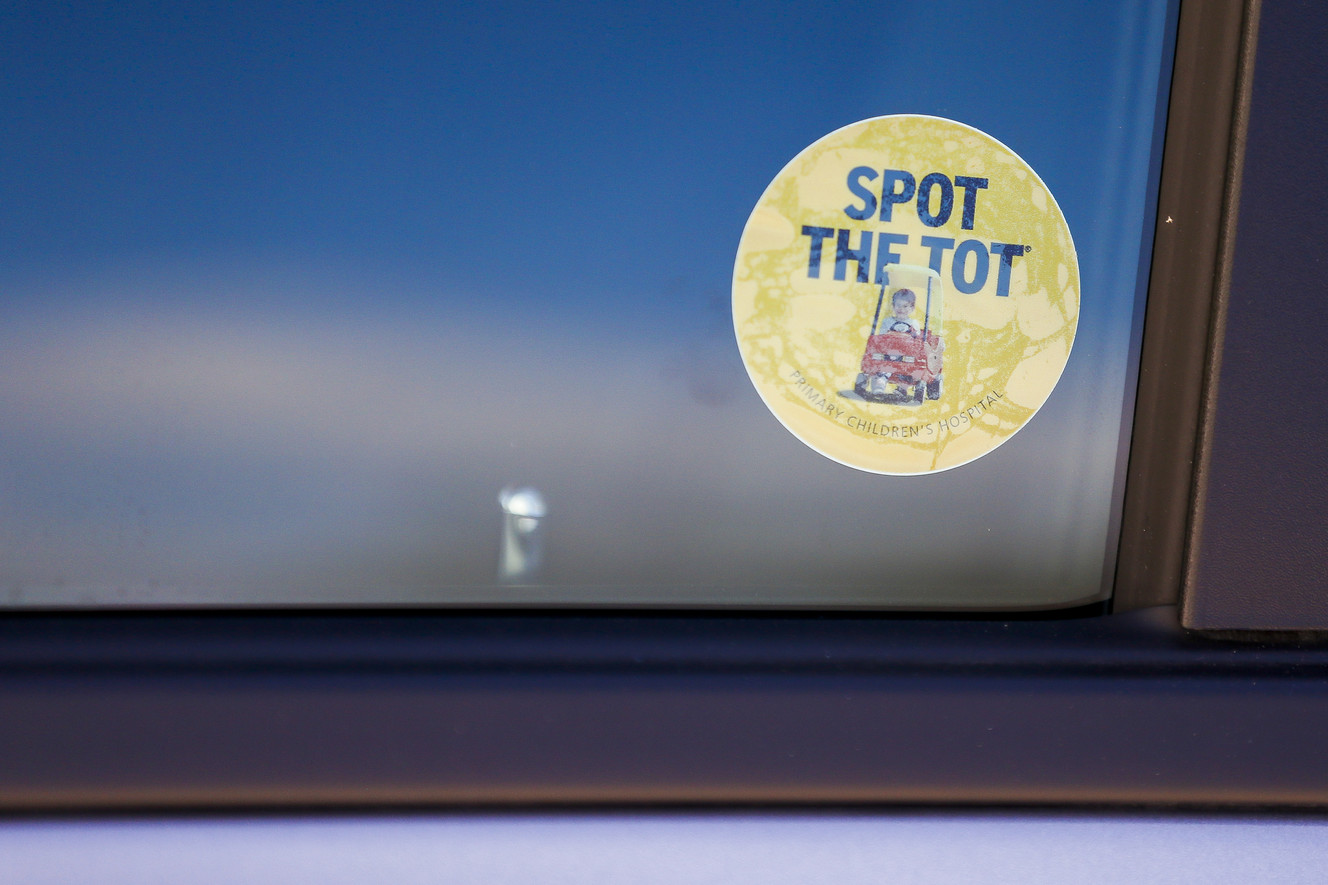 A sticker sits on a passenger side window during a Spot the Tot demonstration at the Primary Children's Hospital Outpatient Services Building in Salt Lake City on Monday, May 15, 2017. (Photo: Alex Goodlett, Deseret News)