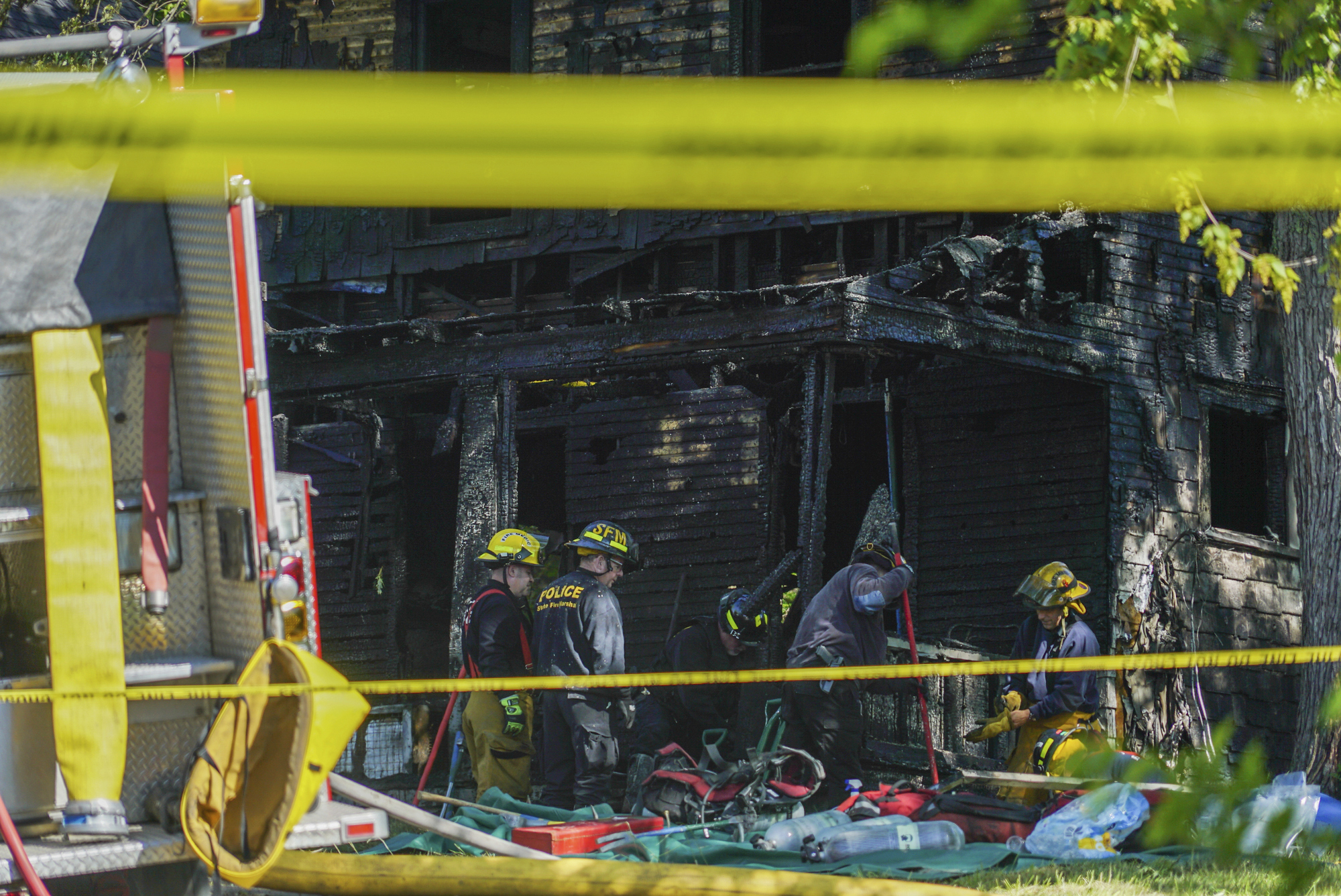 The Latest: Family says 2 adults, 5 children died in fire