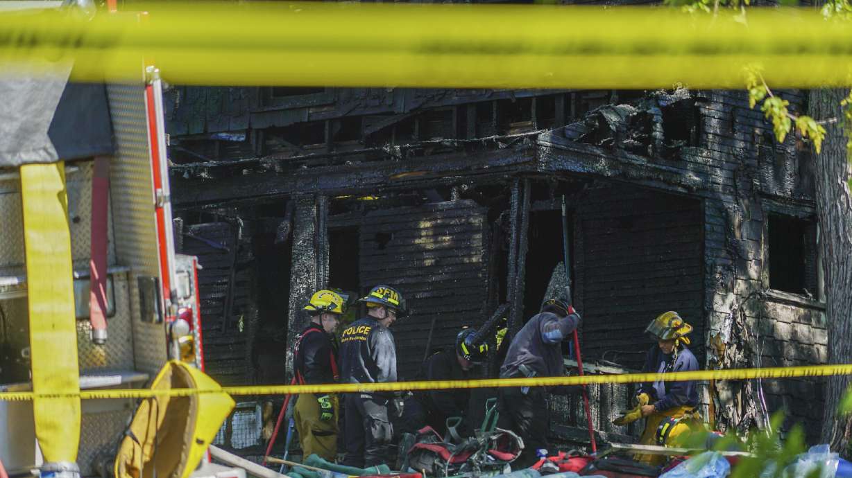 The Latest: Family says 2 adults, 5 children died in fire