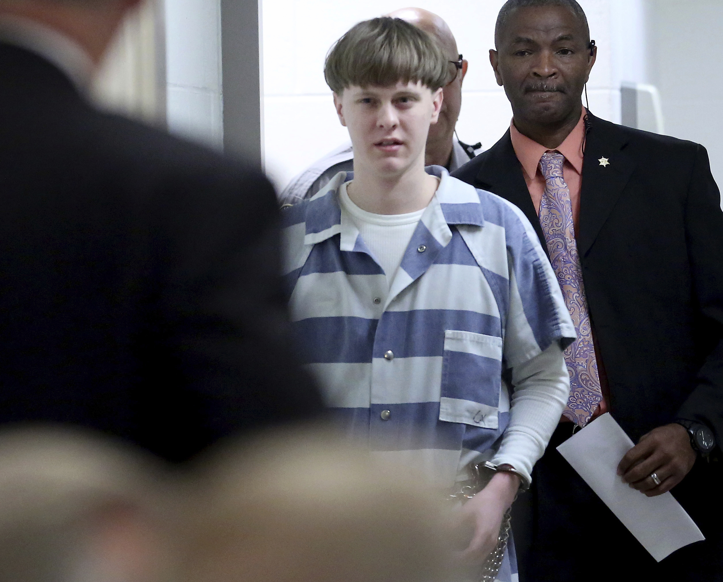 The Latest: Videos show Dylann Roof, family in jail visits