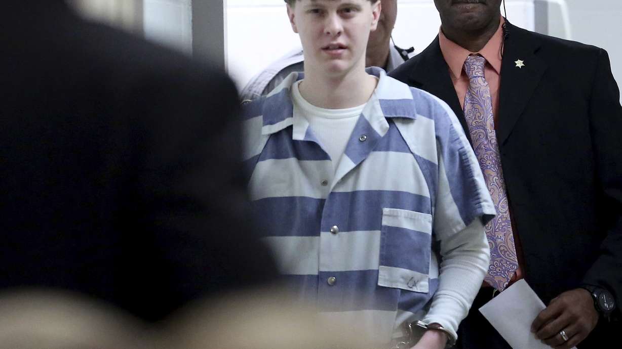 The Latest: Videos show Dylann Roof, family in jail visits