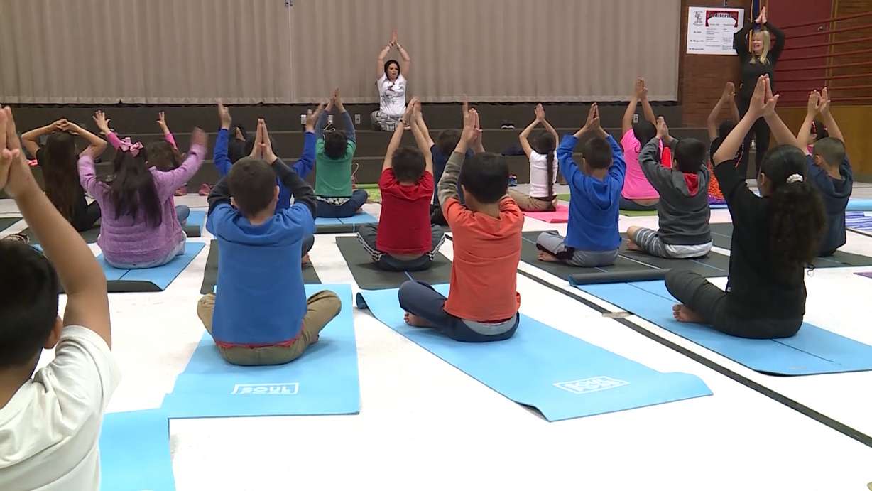 Students do yoga at Lincoln Elementary School in Salt Lake City Tuesday, May 16, 2017. Teachers and students say there are a lot of ways that yoga benefits kids. Photo: Winston Armani, KSL TV