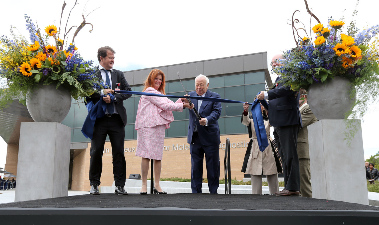 Alexandre Mérieux, CEO of bioMérieux, Chantel Mérieux, Alain Mérieux, bioMérieux founder, and Jean-Luc Belingard, chairman of bioMérieux, cut the ribbon for the Alain Mérieux Center for Molecular Diagnostics in Salt Lake City on Wednesday, May 17, 2017. (Photo: Kristin Murphy, Deseret News)