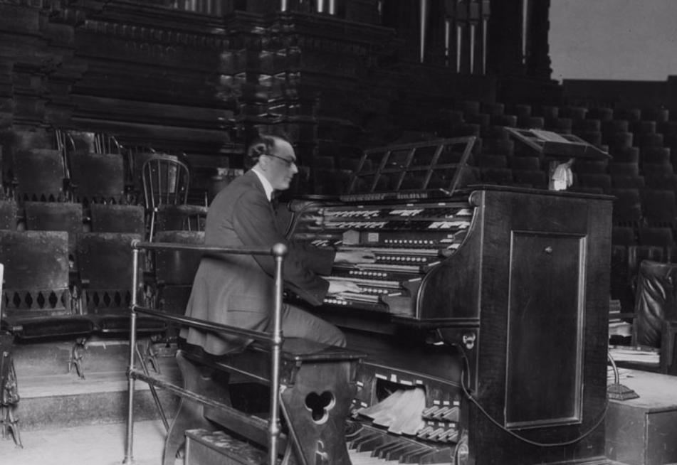 An organist plays the Tabernacle Organ as seen in this photo taken in August 1926. (Photo: Utah Division of History)